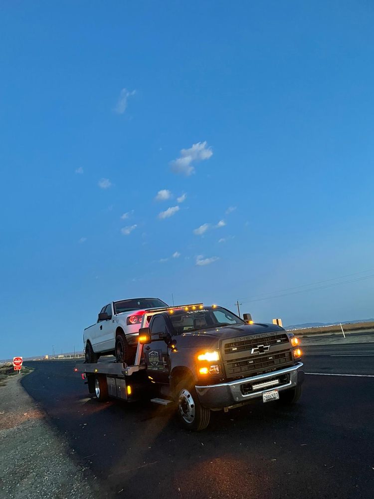 Tow truck on a 24 hour call at night with lights running