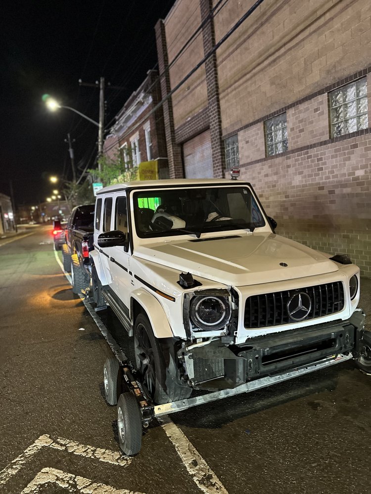 SUV recovered at night under work lights