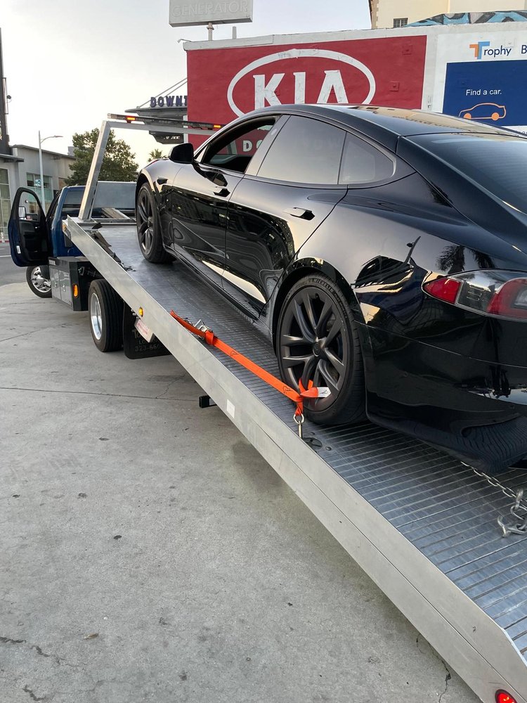 Car delivered by flatbed to a dealership service centre