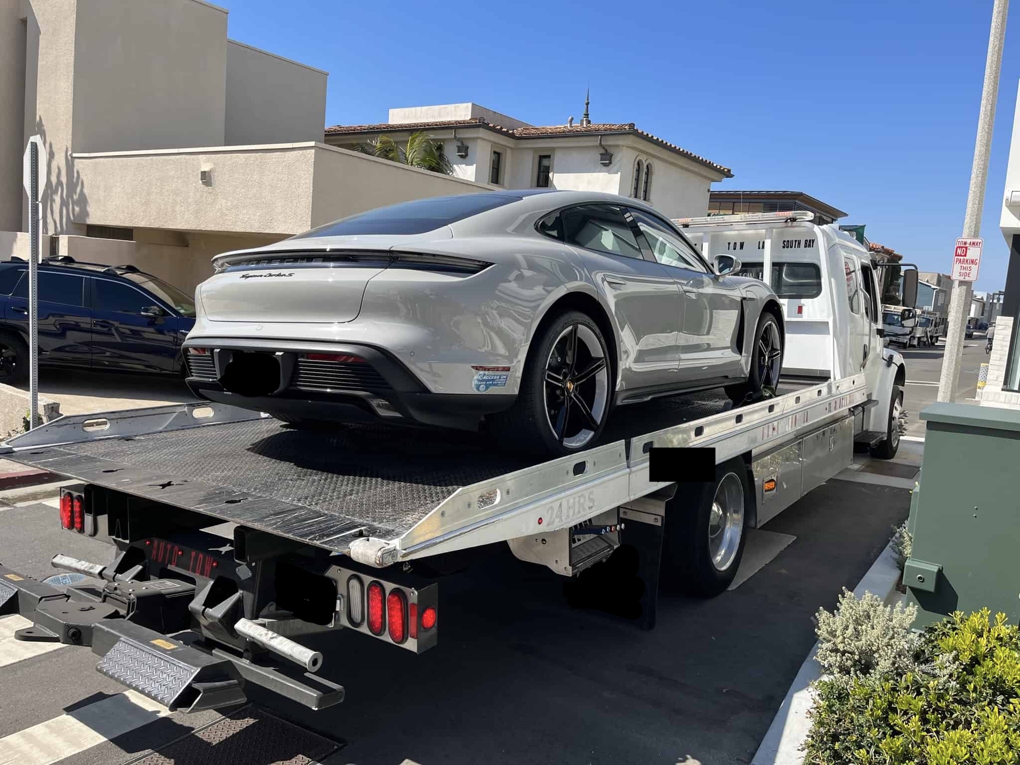 Sports car loaded on a flatbed for damage-free transport